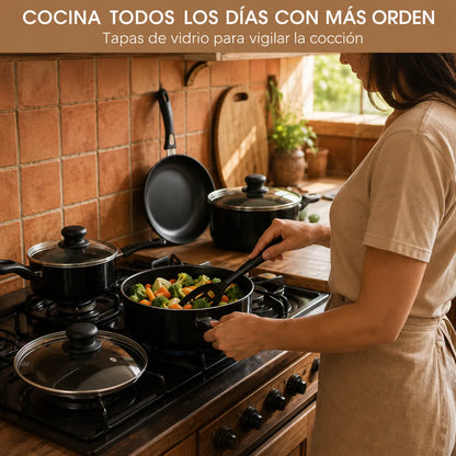 Sartén antiadherente del set cocinando vegetales sobre la estufa